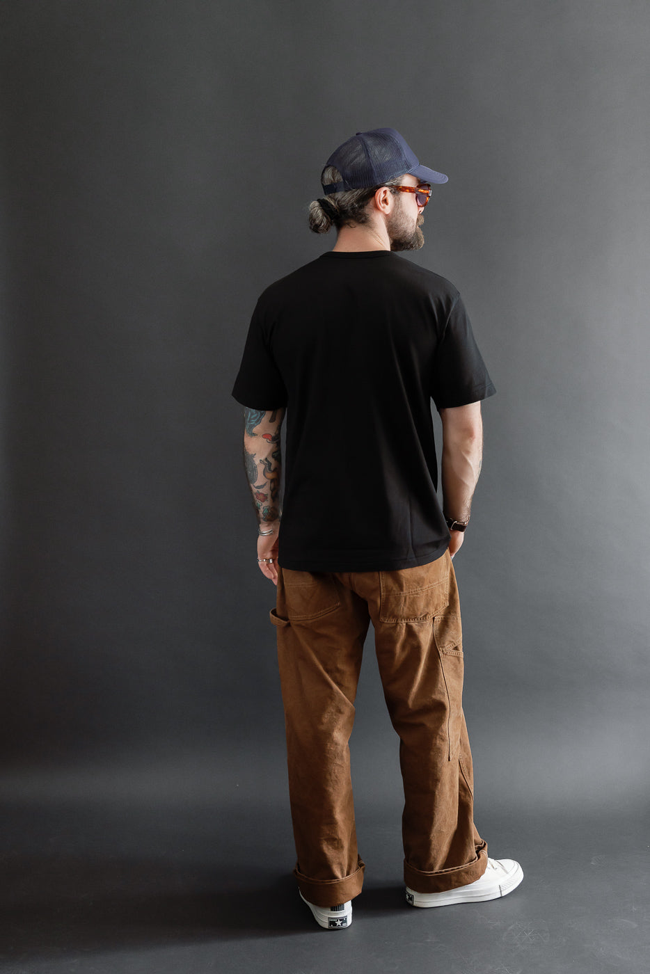 Full body back view of a male model, 5'9