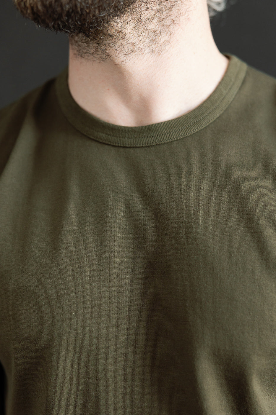 Close-up of the Ultimate Pima Tsuriami Crewneck T-Shirt in Khaki, showcasing the smooth neckline and fine texture of the 100% organic Pima cotton fabric.