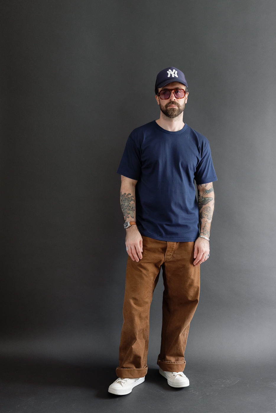 Full body front view of a male model, 5'9
