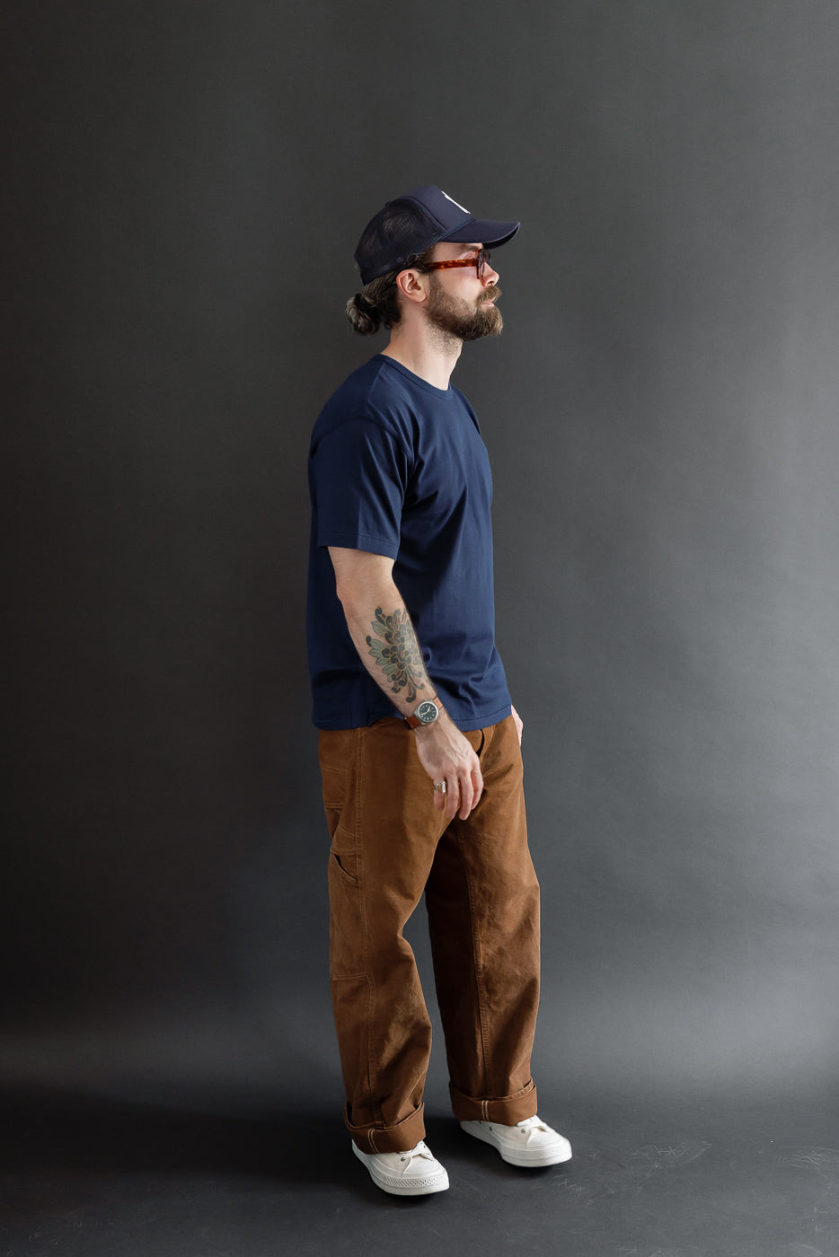Full body side view of a male model, 5'9