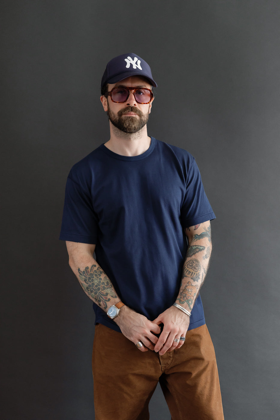 Full body front view of a male model, 5'9