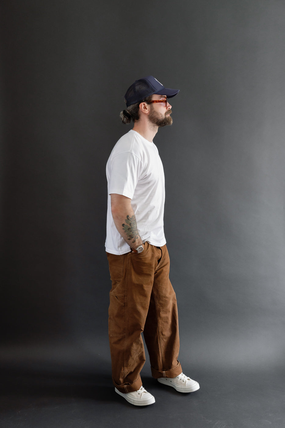 Full body side view of a male model, 5'9