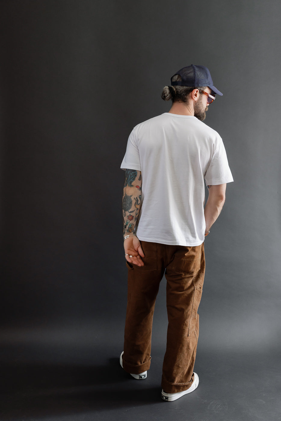 Full body back view of a male model, 5'9