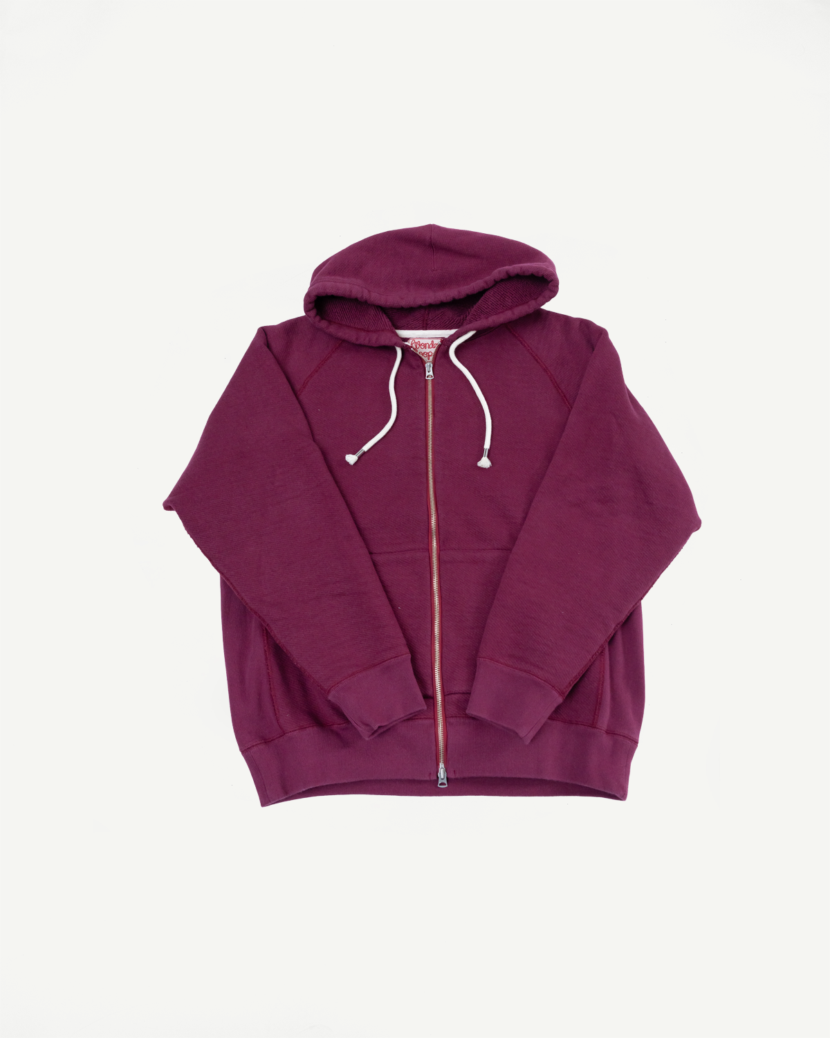 Front view flat lay of a maroon zip-up hoodie with white drawstrings.