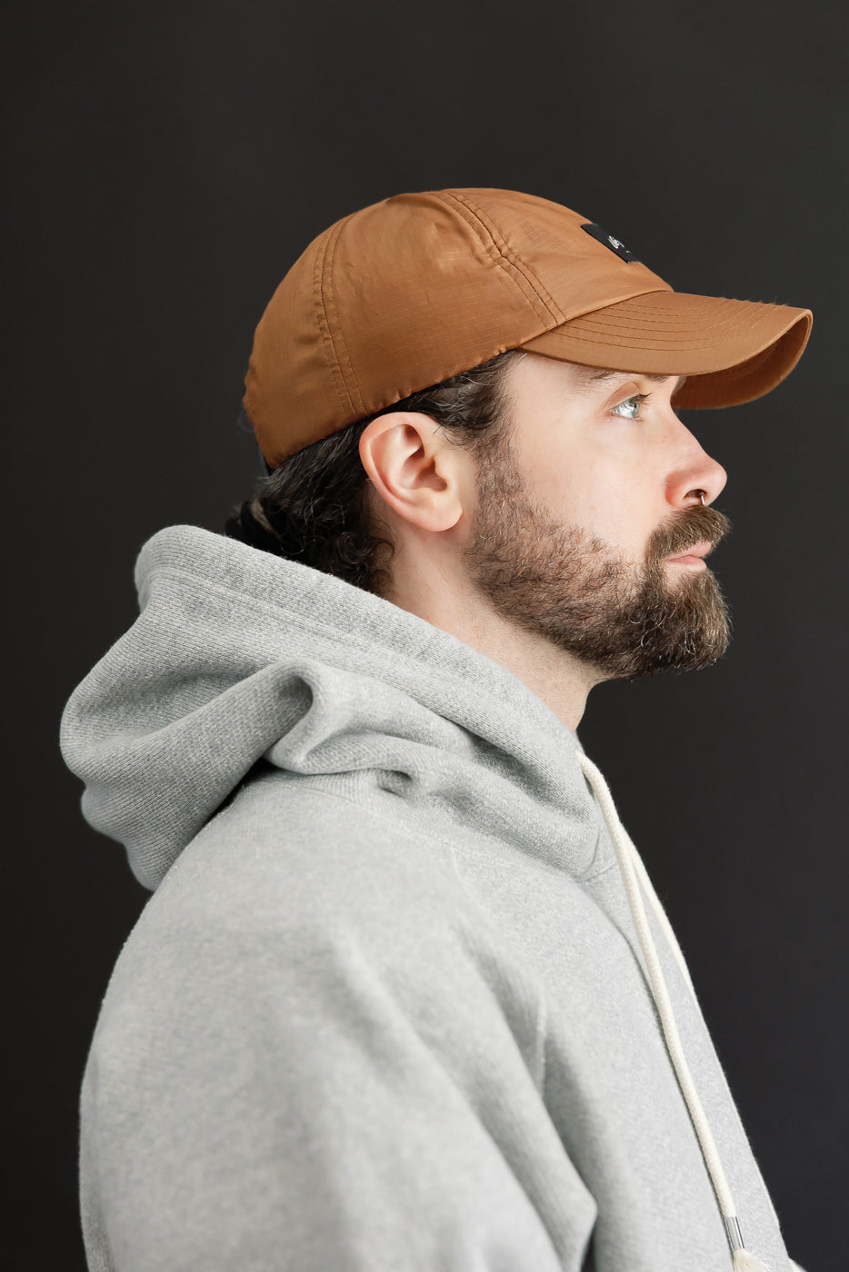 Close-up profile of a male model, 5'9