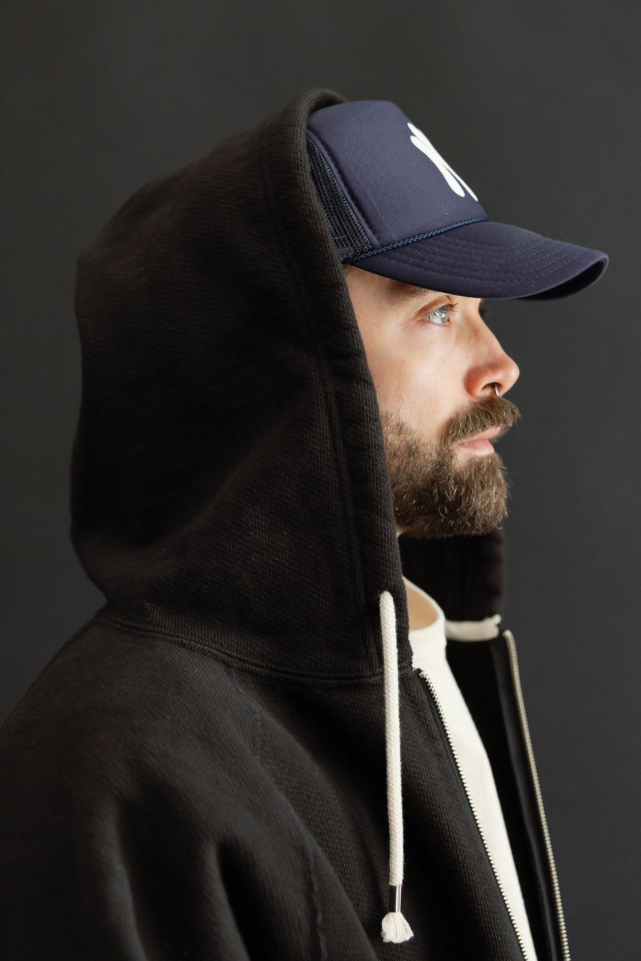 Side profile close-up of a male model, 5'9