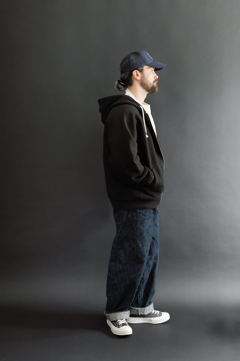Full body side view of a male model, 5'9